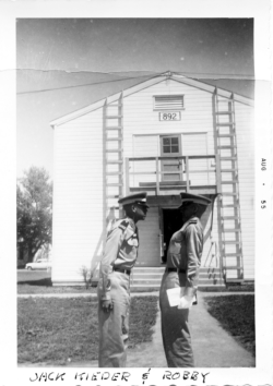 Cadets Jack Kieder and Robby, Aug 1955, in front of student barracks Bldg. 892.  [Wings]