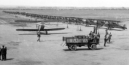 Circa 1930’s: Photo of a Douglas O-2 from the Colorado National Guard’s 120th Aero Observation Squadron, shown in front of a row of Boeing P-12 fighters lined up for an airshow at the original Lowry Field at Dahlia and 38th Avenue.  [Paul Freeman]