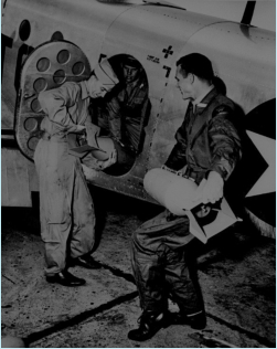 Photo School students loading Flash Bombs aboard photo recon aircraft, enabled night-time photography.  (Wings)