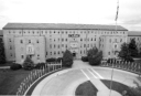 Building 349 as a barracks housed 3,600 men in 1943, became Base HQ in 1961. [Wings]